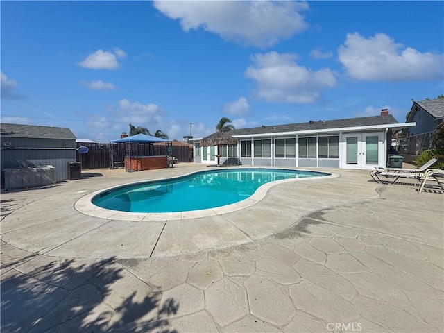 19891 Athenon Ave, Perris, CA 92570 - view of swimming pool featuring a patio, french doors, a shed, and a hot tub