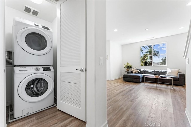 1166 Newberry Ln Unit 1, Claremont, CA 91711 - laundry room featuring estacked washer and dryer, wood finished floors, and recessed lighting