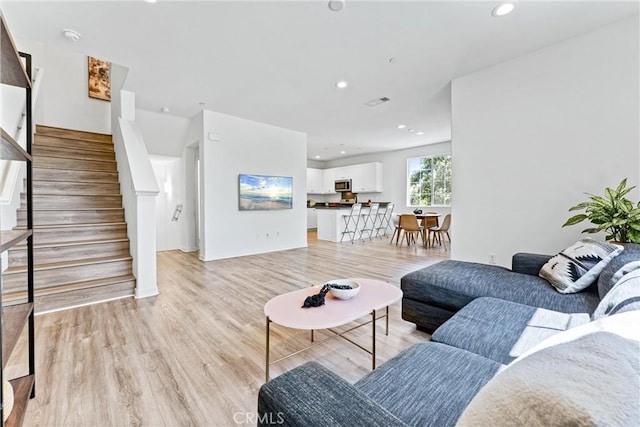 1166 Newberry Ln Unit 1, Claremont, CA 91711 - living area with stairway, light wood-style flooring, and recessed lighting