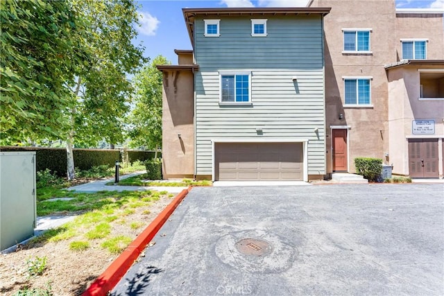 1166 Newberry Ln Unit 1, Claremont, CA 91711 - view of front of house with a garage and asphalt driveway