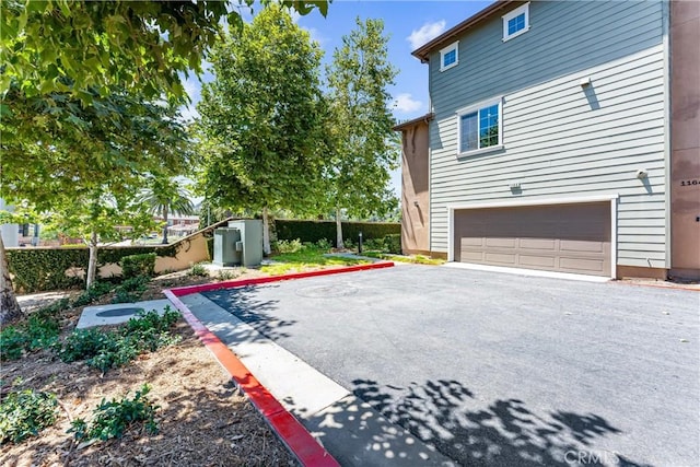1166 Newberry Ln Unit 1, Claremont, CA 91711 - view of property exterior with driveway and a garage