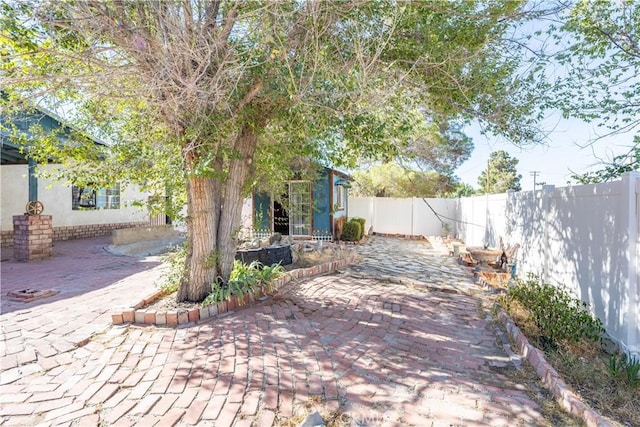 5772 Arrowhead Lake Rd, Hesperia, CA 92345 - fenced backyard featuring a patio area and an outbuilding