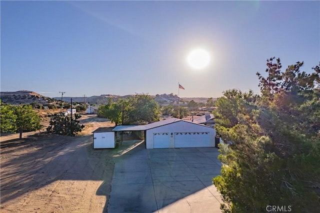 5772 Arrowhead Lake Rd, Hesperia, CA 92345 - view of front of property with concrete driveway and a mountain view