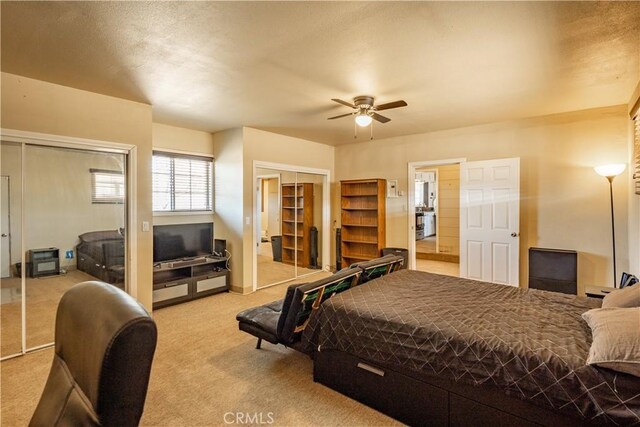 5772 Arrowhead Lake Rd, Hesperia, CA 92345 - bedroom featuring multiple closets, carpet floors, and a ceiling fan