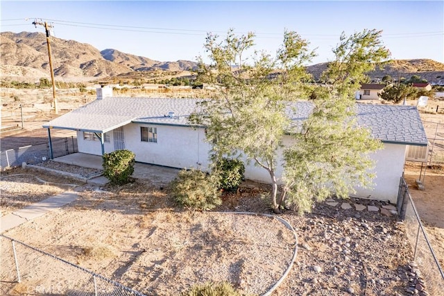 5772 Arrowhead Lake Rd, Hesperia, CA 92345 - view of home's exterior with stucco siding and a mountain view
