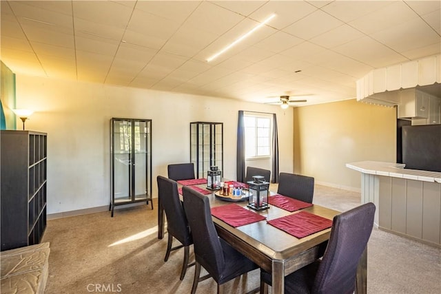 5772 Arrowhead Lake Rd, Hesperia, CA 92345 - dining space featuring light colored carpet and a ceiling fan