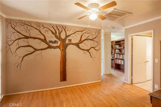 5772 Arrowhead Lake Rd, Hesperia, CA 92345 - empty room with wood finished floors, ceiling fan, and crown molding
