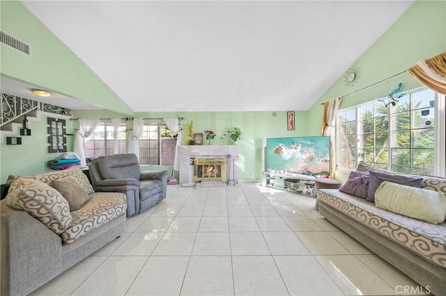 1740 Rada Rd, Hacienda Heights, CA 91745 - tiled living room featuring high vaulted ceiling, a glass covered fireplace, and plenty of natural light