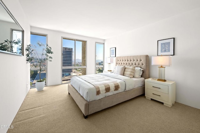 800 W 1st St Unit 1701, Los Angeles, CA 90012 - bedroom featuring multiple windows, light carpet, and access to exterior