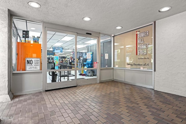 800 W 1st St Unit 1701, Los Angeles, CA 90012 - lobby featuring a textured ceiling and recessed lighting