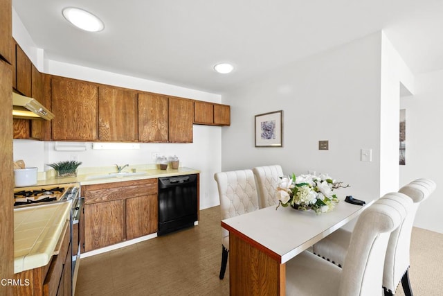 800 W 1st St Unit 1701, Los Angeles, CA 90012 - kitchen with brown cabinetry, black dishwasher, gas stove, under cabinet range hood, and a breakfast bar