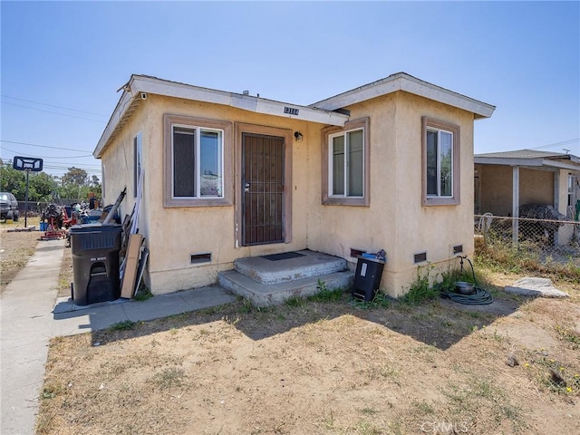 13114 S Main St, Los Angeles, CA 90061 - view of front of home featuring crawl space and stucco siding