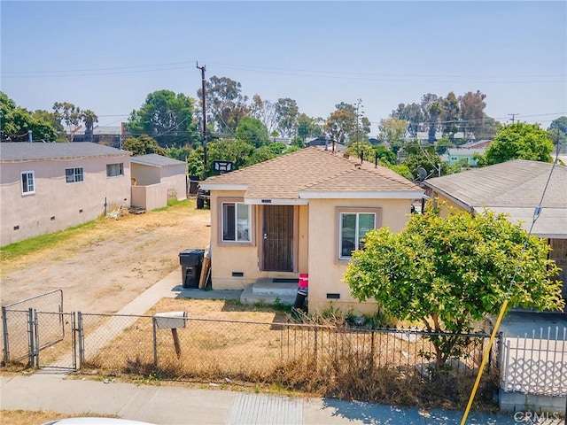 13114 S Main St, Los Angeles, CA 90061 - bungalow-style home featuring crawl space, a gate, a shingled roof, and stucco siding