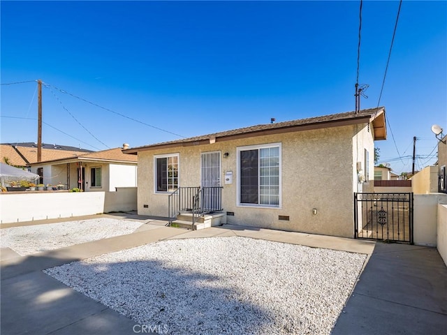 1735 257th St, Lomita, CA 90717 - back of property featuring stucco siding, a gate, and a patio