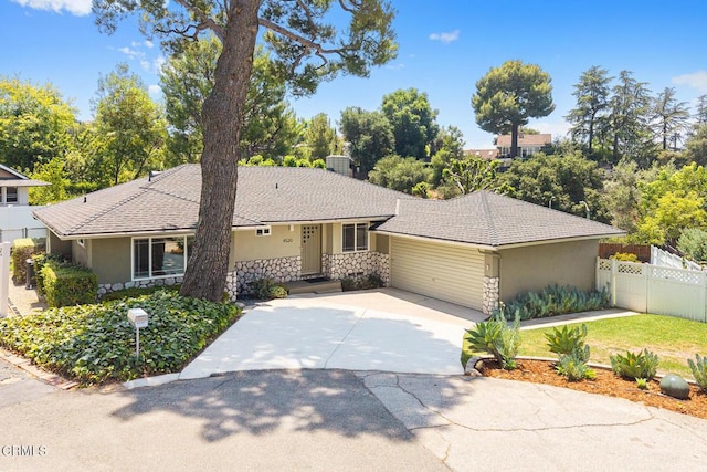 4520 Lone Pine Ln, La Canada Flintridge, CA 91011 - single story home featuring stone siding, a garage, stucco siding, and driveway