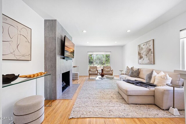 4520 Lone Pine Ln, La Canada Flintridge, CA 91011 - living room featuring wood finished floors, a large fireplace, and recessed lighting