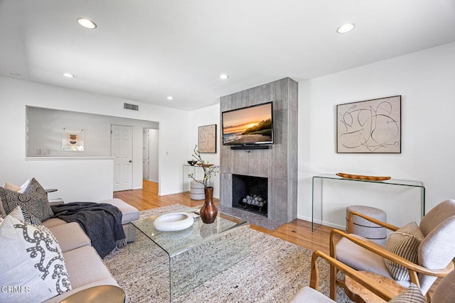 4520 Lone Pine Ln, La Canada Flintridge, CA 91011 - living room featuring light wood-type flooring, a large fireplace, and recessed lighting