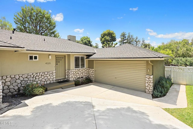4520 Lone Pine Ln, La Canada Flintridge, CA 91011 - view of front of property with a garage, driveway, stone siding, stucco siding, and roof with shingles