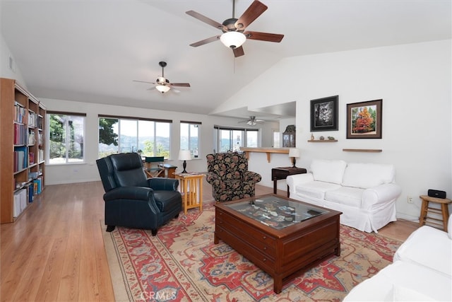 45337 Valley Oak Dr, Ahwahnee, CA 93601 - living area with a ceiling fan, plenty of natural light, vaulted ceiling, and light wood-style floors