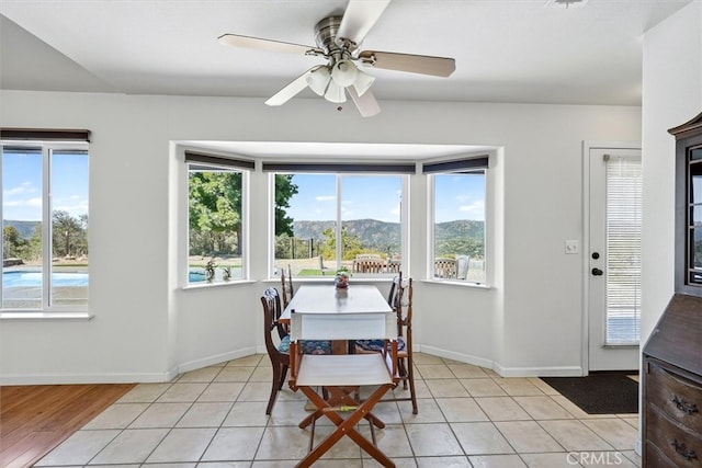 45337 Valley Oak Dr, Ahwahnee, CA 93601 - dining area with healthy amount of natural light, a mountain view, ceiling fan, and light tile patterned floors