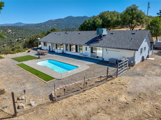 45337 Valley Oak Dr, Ahwahnee, CA 93601 - outdoor pool with a mountain view, a patio, and a fenced backyard