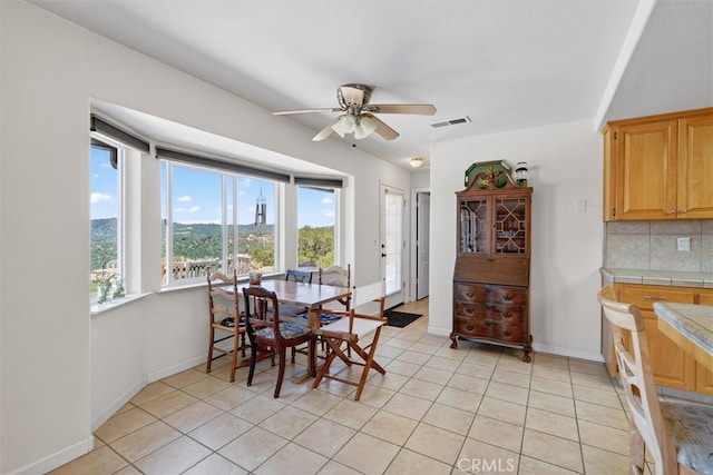 45337 Valley Oak Dr, Ahwahnee, CA 93601 - dining area with ceiling fan and light tile patterned flooring