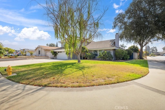 3314 Benton Ave, La Verne, CA 91750 - view of front of house featuring concrete driveway, a front yard, a garage, a chimney, and stucco siding