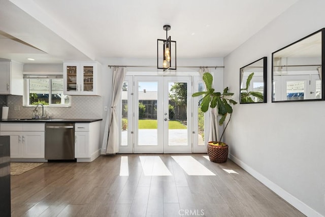 3314 Benton Ave, La Verne, CA 91750 - kitchen with dishwasher, french doors, plenty of natural light, and dark countertops