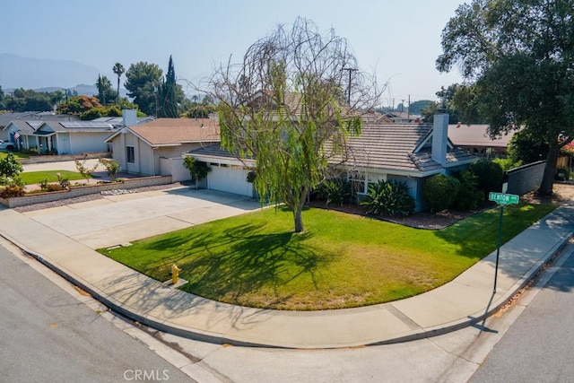3314 Benton Ave, La Verne, CA 91750 - ranch-style home with concrete driveway, a front lawn, a chimney, an attached garage, and a tiled roof