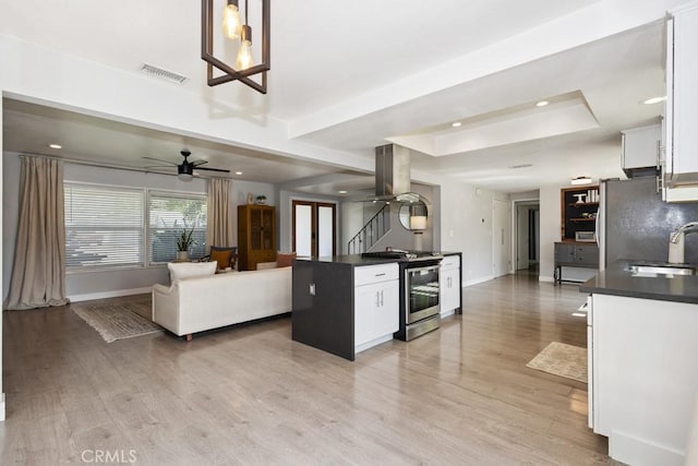 3314 Benton Ave, La Verne, CA 91750 - kitchen featuring island exhaust hood, dark countertops, open floor plan, stainless steel appliances, and recessed lighting