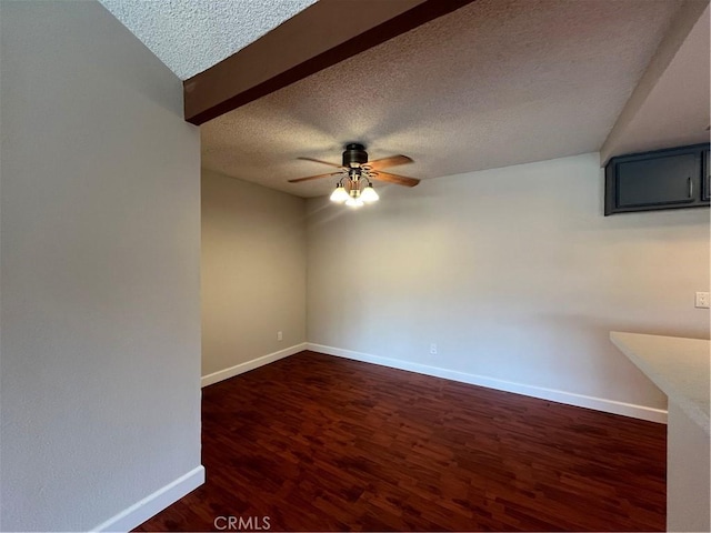 22 Country Mile Rd, Pomona, CA 91766 - empty room with a textured ceiling, a ceiling fan, and dark wood finished floors