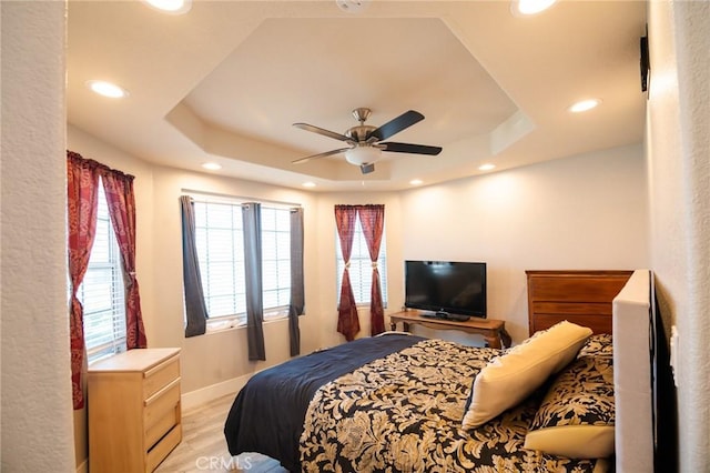 26511 Mainsail Ln, Helendale, CA 92342 - bedroom with a raised ceiling, recessed lighting, light wood-style floors, and ceiling fan