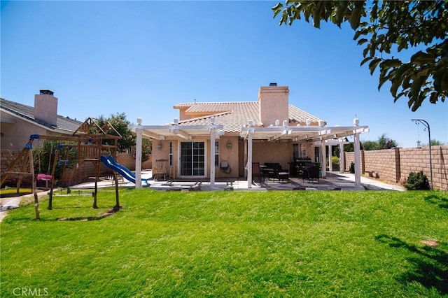 26511 Mainsail Ln, Helendale, CA 92342 - back of property with a pergola, a patio, a playground, a tiled roof, and a chimney