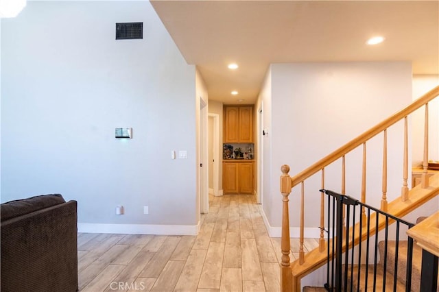 26511 Mainsail Ln, Helendale, CA 92342 - corridor featuring recessed lighting, light wood-type flooring, and stairway