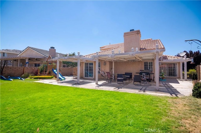 26511 Mainsail Ln, Helendale, CA 92342 - back of house featuring a pergola, a chimney, a playground, and a tile roof