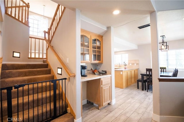 26511 Mainsail Ln, Helendale, CA 92342 - bar featuring plenty of natural light, stairway, light wood-style flooring, and recessed lighting