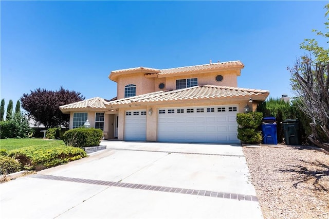 26511 Mainsail Ln, Helendale, CA 92342 - mediterranean / spanish-style home with concrete driveway, stucco siding, an attached garage, and a tiled roof