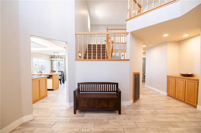 26511 Mainsail Ln, Helendale, CA 92342 - corridor featuring a towering ceiling, wood tiled floors, a chandelier, and recessed lighting