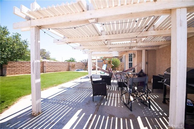 26511 Mainsail Ln, Helendale, CA 92342 - fenced backyard featuring a patio area and a pergola