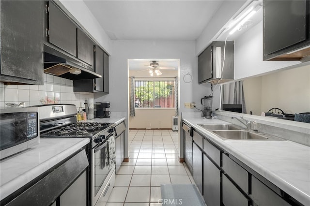 11286 Parkside Ln Unit 22, Garden Grove, CA 92843 - kitchen featuring stainless steel appliances, under cabinet range hood, light tile patterned flooring, decorative backsplash, and ceiling fan