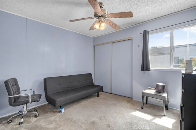 11286 Parkside Ln Unit 22, Garden Grove, CA 92843 - sitting room with a textured ceiling, carpet flooring, and a ceiling fan
