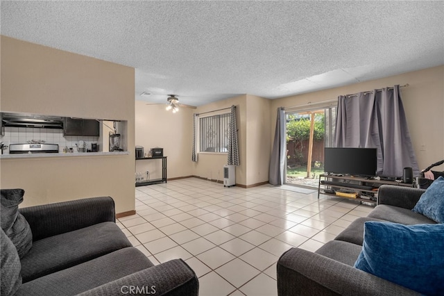 11286 Parkside Ln Unit 22, Garden Grove, CA 92843 - living room featuring light tile patterned floors, a ceiling fan, and a textured ceiling