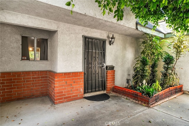 11286 Parkside Ln Unit 22, Garden Grove, CA 92843 - entrance to property featuring stucco siding and brick siding