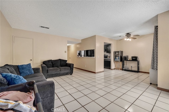 11286 Parkside Ln Unit 22, Garden Grove, CA 92843 - living room featuring a textured ceiling, ceiling fan, and light tile patterned floors