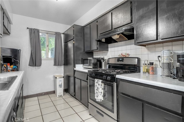 11286 Parkside Ln Unit 22, Garden Grove, CA 92843 - kitchen featuring stainless steel appliances, under cabinet range hood, light countertops, and backsplash