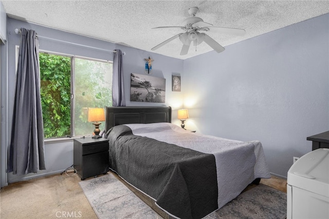 11286 Parkside Ln Unit 22, Garden Grove, CA 92843 - bedroom featuring a textured ceiling, a ceiling fan, and light carpet