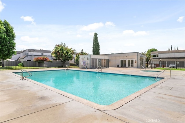 11286 Parkside Ln Unit 22, Garden Grove, CA 92843 - community pool featuring a patio and french doors