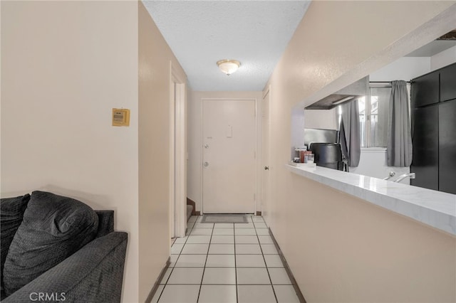 11286 Parkside Ln Unit 22, Garden Grove, CA 92843 - corridor featuring light tile patterned floors and a textured ceiling