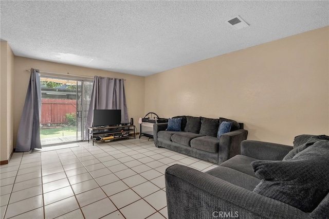 11286 Parkside Ln Unit 22, Garden Grove, CA 92843 - living area with a textured ceiling and light tile patterned floors