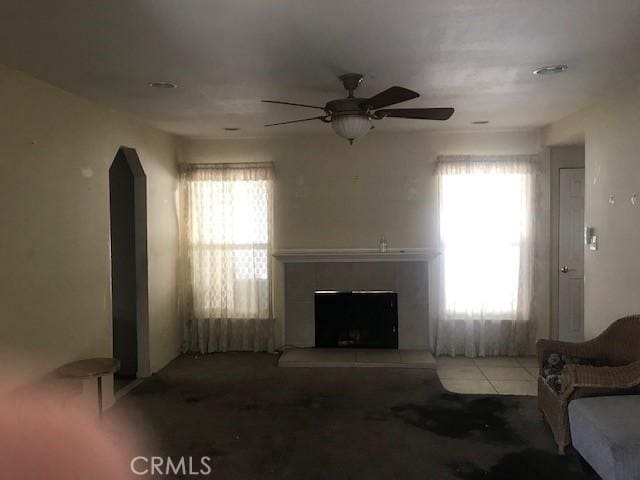 2710 Castle Rock Rd, Diamond Bar, CA 91765 - living area with ceiling fan, arched walkways, and a fireplace with raised hearth